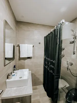 a bathroom with a sink and a shower at Zlatokosina zona Kopaonik Milmari NLux in Kopaonik