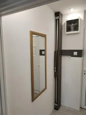 a mirror on a wall in a room at VIN Studio in Kruševac