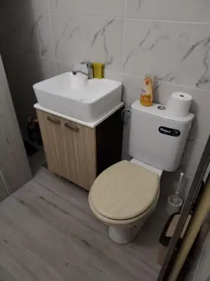 a bathroom with a toilet and a sink at VIN Studio in Kruševac