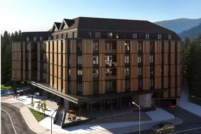 an architectural rendering of a large building with a parking lot at Woodside Lux Duplex in Kopaonik
