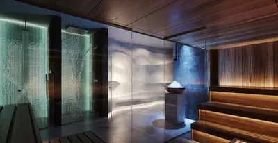 a bathroom with a glass shower and a glass wall at Woodside Lux Duplex in Kopaonik