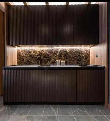 a kitchen with a sink and a counter top at Woodside Lux Duplex in Kopaonik