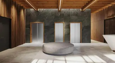 a round ottoman in a room with four doors at Woodside Lux Duplex in Kopaonik
