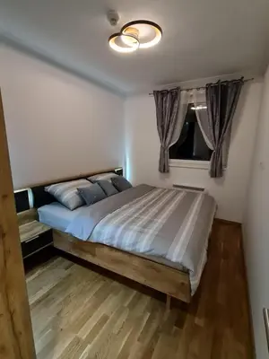 a bedroom with a large bed in a room at E&M Platinum in Kopaonik