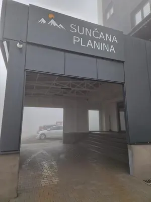 a car is parked in a parking lot at E&M Platinum in Kopaonik