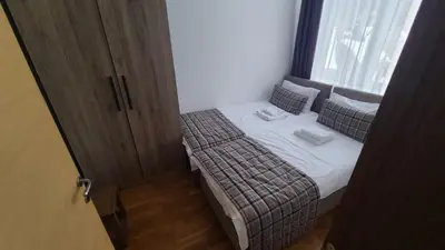 a small bedroom with a bed and a window at Kolakovic in Brzeće
