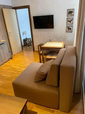 a living room with a couch and a table at Kolakovic in Brzeće