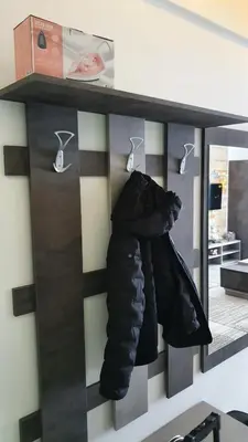 a rack with jackets hanging on a wall at N LUX in Kopaonik