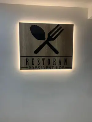 a sign for a restaurant with a spoon and fork at FIONA Kopaonik in Kopaonik