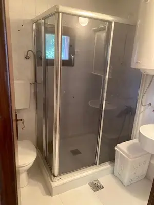 a bathroom with a shower and a toilet at Petra in Kopaonik