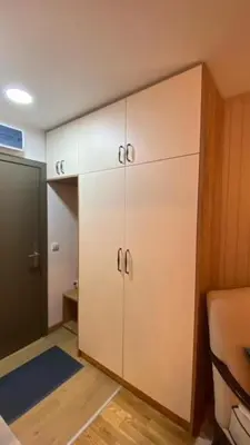 a room with a closet with white cabinets at Jankov konak in Kopaonik