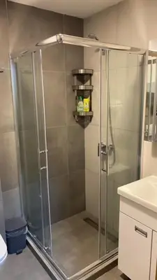 a shower with a glass door in a bathroom at Jankov konak in Kopaonik