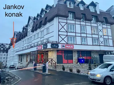 a building with a car parked in front of it at Jankov konak in Kopaonik