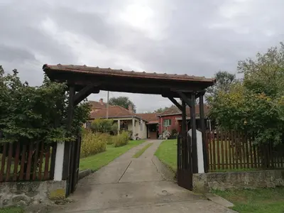 a wooden gate in a yard with a fence at Markov konak in Babušnica