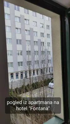 a view of a building from a window at Apartman Vivaldi - CENTAR in Vrnjačka Banja
