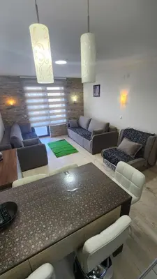 a living room with a couch and a table at Kopaonik in Kopaonik