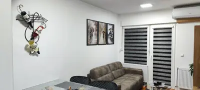 a living room with a couch and a table at Marinkovic stan na dan in Vranje