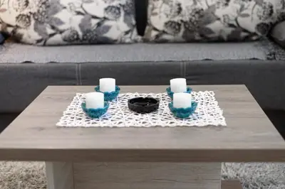 a coffee table with candles on top of it at Apartman Leki in Kopaonik