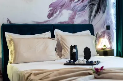 a bed with a plate with a penguin on it at Promenada Grujić in Vrnjačka Banja