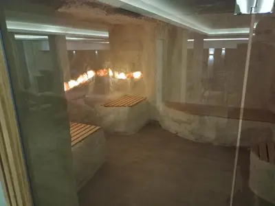 a room with a tub with a fireplace in it at Milmari N Lux 52 in Kopaonik