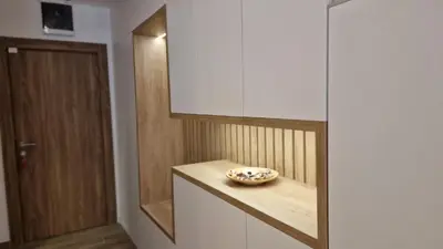 a room with a bowl on a counter with a door at Xenia Apartment in Kopaonik