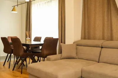 a living room with a couch and a table at Vila Golija in Kopaonik