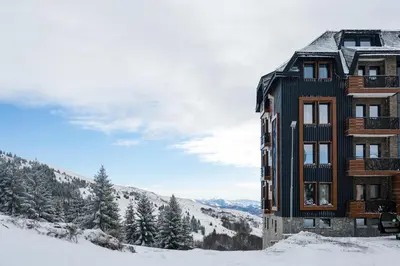 a building on top of a snow covered mountain at Vila Golija in Kopaonik