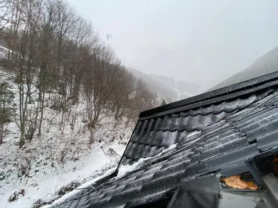 a snow covered roof of a train at Bele Staze Apartman 86 in Brzeće