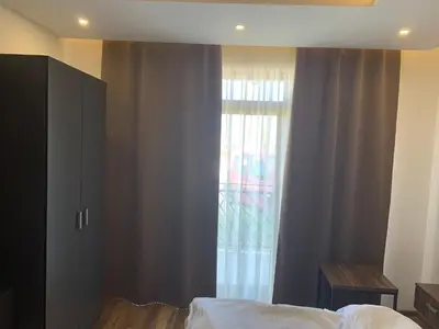 a bedroom with a bed and a window at President Kop S2 in Kopaonik