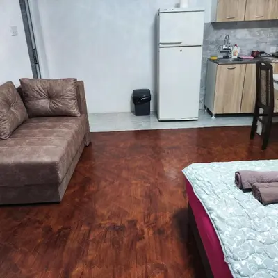 a living room with a couch and a refrigerator at Bagdala 2 in Kruševac