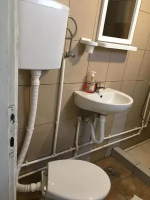 a bathroom with a toilet and a sink at VILA ZORICA in Ribarska Banja