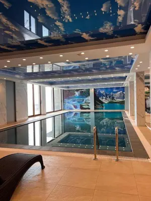 a swimming pool in the middle of a building at President Kop A 735 in Kopaonik