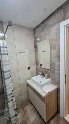 a bathroom with a sink and a mirror at Magic Kop - Milmari Resort in Kopaonik