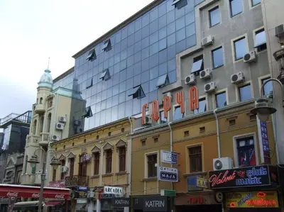 a building with a sign on the side of it at City Center Studio in Niš