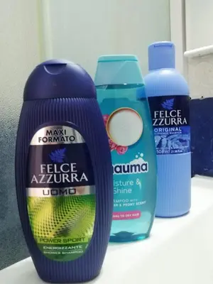 a group of bottles of cleaning products sitting on a counter at City Center Studio in Niš