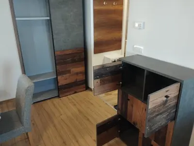 a room with a desk and a chair in a room at Apartman Iznad Oblaka in Kopaonik