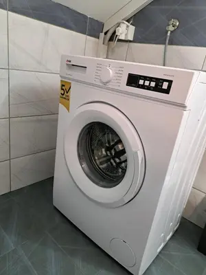 a white washing machine sitting in a bathroom at Relja in Soko Banja