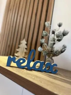 a wooden shelf with a vase of flowers on it at MD apartman Vranje FREE PARKING in Vranje