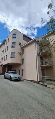 a car parked in front of a building at Apartman Pikolo VB in Vrnjačka Banja