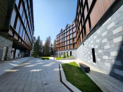 an empty courtyard in front of a building at Woodside 430 Apartment in Kopaonik