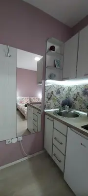 a small kitchen with a sink and two bunk beds at KOSA APARTMAN in Vrnjačka Banja