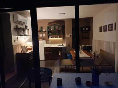 a view of a kitchen and a dining room at Domus in natura in Cerovak