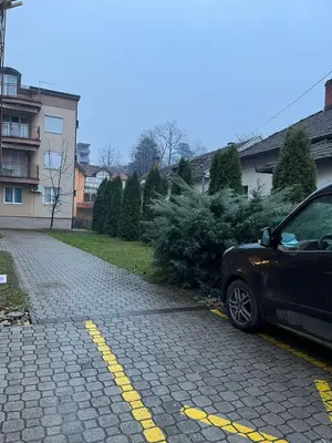 a car parked on the side of a street at Apartman Studio AGAPE in Vrnjačka Banja