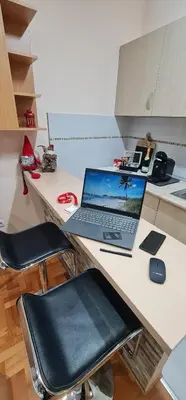 a laptop computer sitting on top of a desk at Design Apartment BUSINESS LUX 4 STAR 