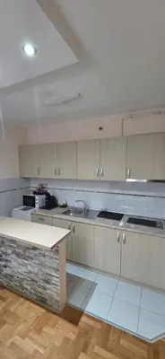 a large kitchen with a sink and a counter at Design Apartment BUSINESS LUX 4 STAR 