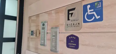 a door of a building with a sign on it at Design Apartment BUSINESS LUX 4 STAR 