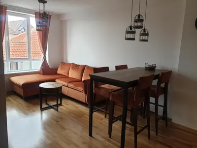 a living room with a couch and a table at Apartman Sofy Kraljevi Čardaci in Kopaonik