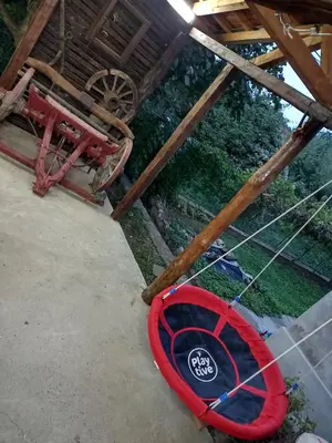 a red frisbee on the ground in a building at House Seoska OAZA in Crnoklište