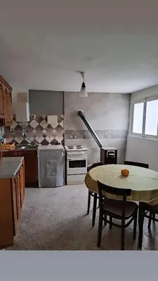 a kitchen with a table and a table sidx sidx sidx sidx at House Seoska OAZA in Crnoklište