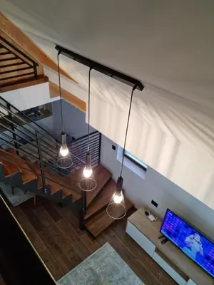 an overhead view of a living room with three lights at Garnet Star Apartments, Kopaonik, apartman broj 4 in Kopaonik